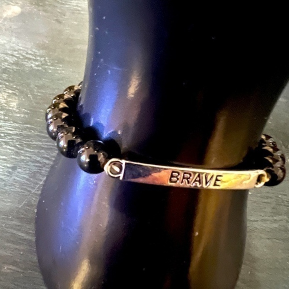 BRAVE silver tone plate & black beaded bracelet. NWOT.
